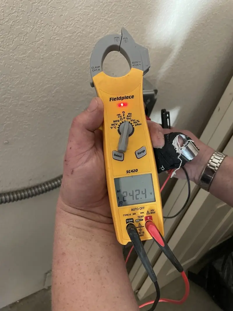 Voltage testing with clamp meter during Electrical Installation Services in Glen Raven